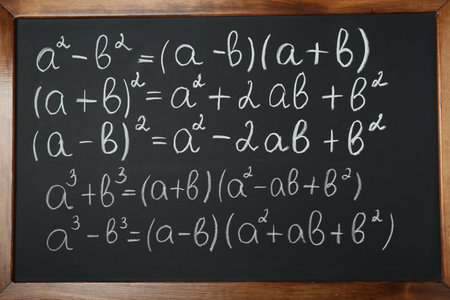 Many different math formulas written on chalkboard, closeupの写真素材