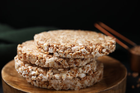 Stack of crunchy buckwheat cakes on wooden plate, closeupの写真素材