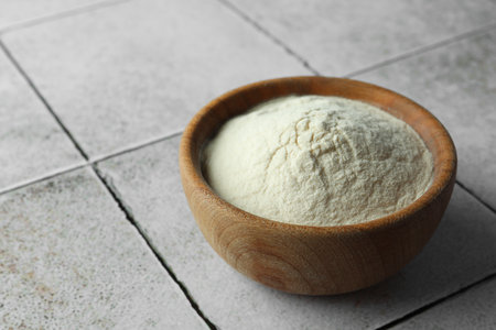 Bowl of agar-agar powder on tiled table, closeupの写真素材