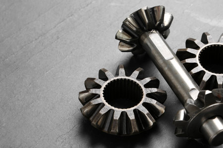 Different stainless steel gears on light gray background, closeup. Space for textの写真素材