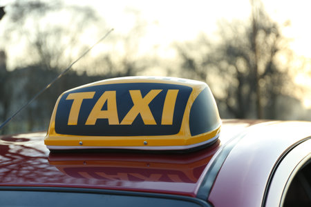 Roof light with word TAXI on car outdoorsの写真素材