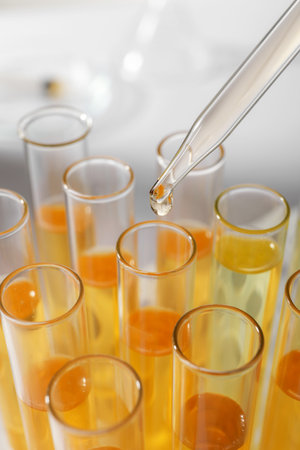 Dropping urine sample for analysis into tube, closeupの写真素材