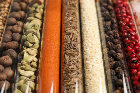Glass tubes with different spices, closeup view