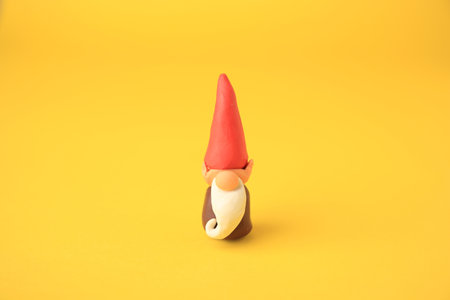 Dwarf made from plastic on yellow background. Children's handmade ideasの写真素材