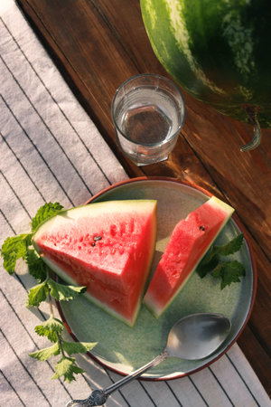 Flat lay composition with tasty ripe watermelons on wooden tableの写真素材