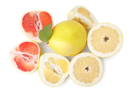 Cut and whole fresh pomelo fruits on white background, top viewの写真素材