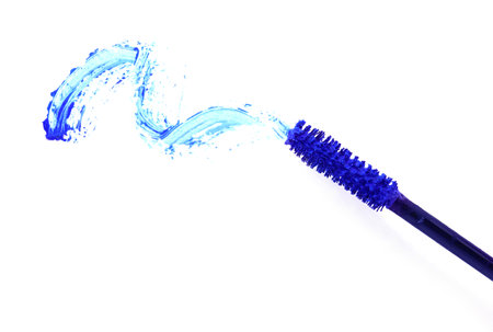Applicator and blue mascara smear on white background, top viewの写真素材