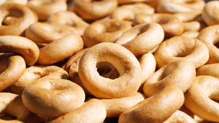 Tasty dry bagels (sushki) as background, closeupの写真素材