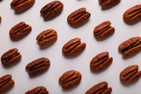 Delicious fresh pecan nuts on white background, flat layの写真素材