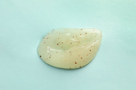 Sample of scrub on light blue background, top view