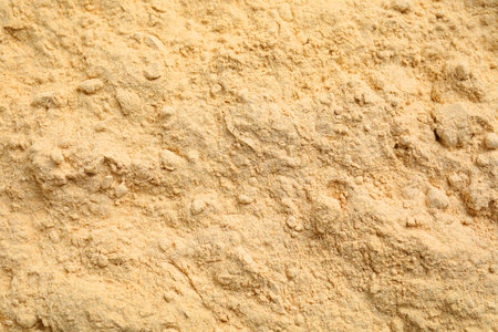 Sesame flour as background, closeup. top view