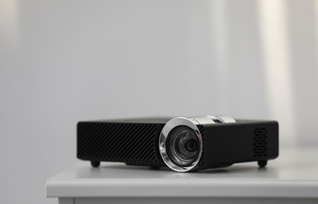 Modern video projector on white table indoorsの写真素材