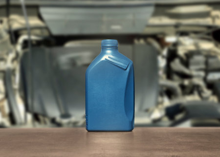 Motor oil in blue container on gray tableの写真素材