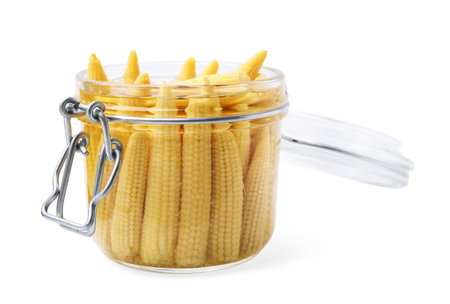 Jar of pickled baby corn isolated on whiteの写真素材
