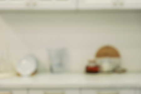 White stylish kitchen with utensils on countertop, blurred view. interior designの写真素材