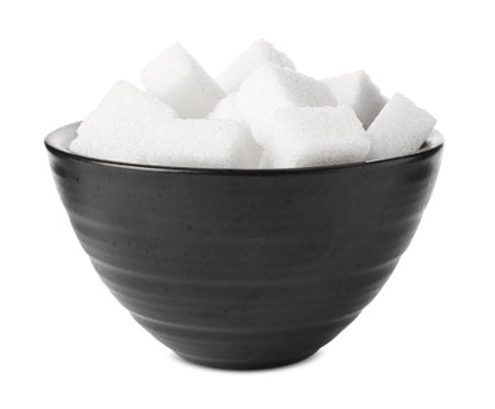 Bowl of refined sugar cubes isolated on whiteの写真素材