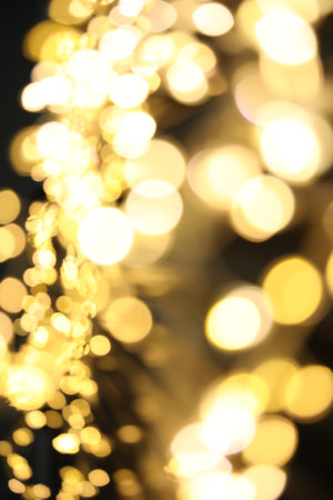 Golden blurred lights on black background. bokeh effectの写真素材