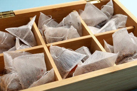 Many tea bags in wooden box, closeupの写真素材