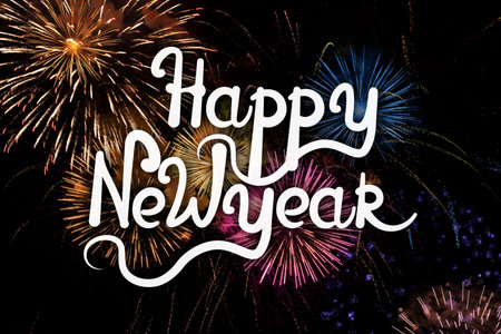 Happy New Year. Beautiful bright firework lighting up night sky