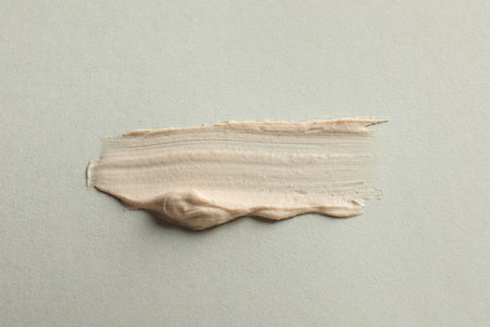 Sample of face mask on light background, top view