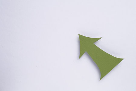 Paper arrow on white background, top view. Space for textの写真素材