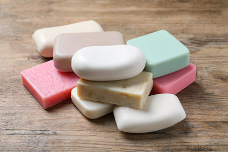 Many different soap bars on wooden tableの写真素材