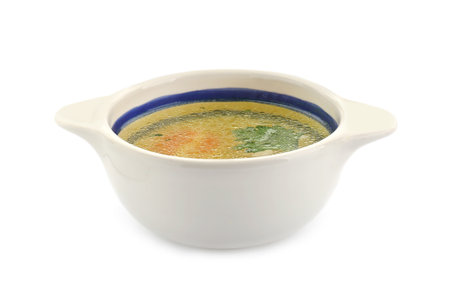 Delicious chicken bouillon with parsley in bowl on white backgroundの写真素材