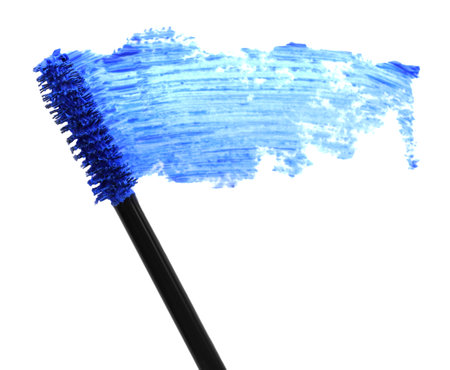 Applicator and blue mascara smear on white background, top viewの写真素材