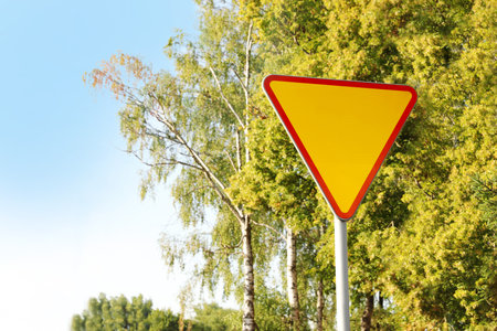 Traffic sign Yield outdoors on sunny day, space for textの写真素材