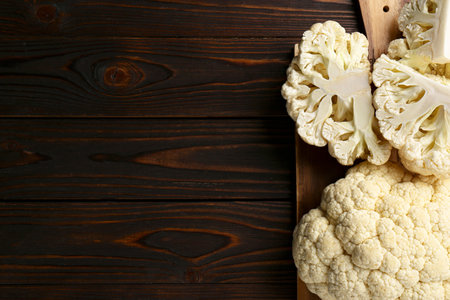 Fresh raw cauliflower on wooden table, top view. Space for textの写真素材