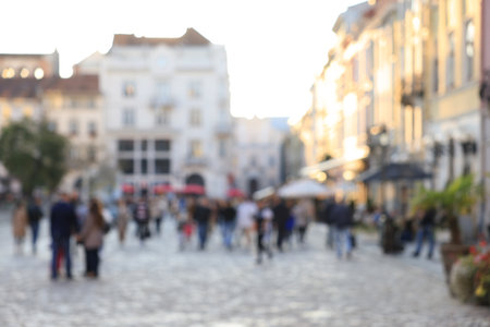 Blurred view of people walking on city streetの写真素材