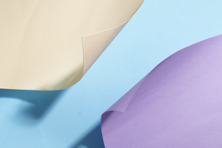 Different colorful paper sheets on light blue backgroundの写真素材