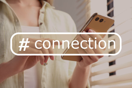 hashtag connection. Woman using smartphone indoors, closeup