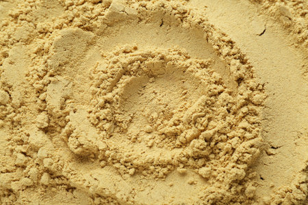 Aromatic mustard powder as background, top viewの写真素材