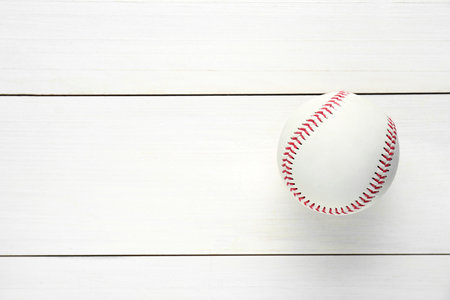 Baseball ball on white wooden table, top view with space for text. sports gameの写真素材
