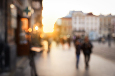 Blurred view of people walking on city streetの写真素材
