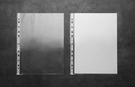 Punched pockets on light gray table, flat layの写真素材