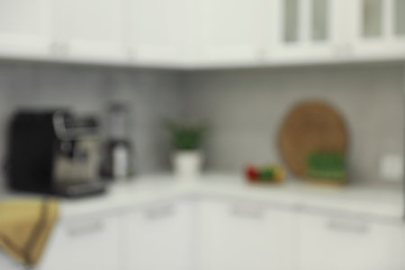 White stylish kitchen with furniture, blurred view. interior designの写真素材