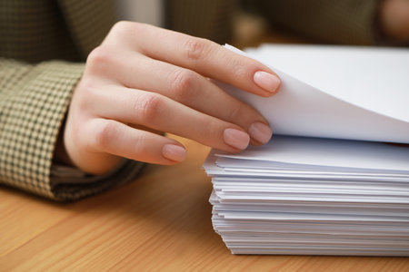 Woman working with documents at table in office, closeupの写真素材