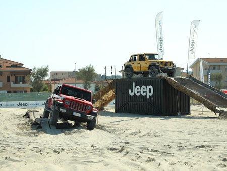 SENIGALLIA, ITALY - JULY 22, 2022: Jeep test drive on sand outdoors. car presentationのeditorial素材