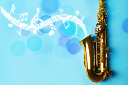 Music notes and other musical symbols flowing from saxophone on light blue backgroundの写真素材
