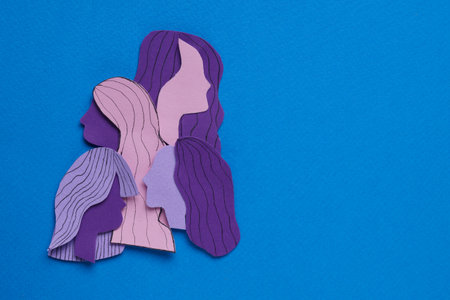 woman's health. Female paper figures on light blue background, flat lay with space for textの写真素材