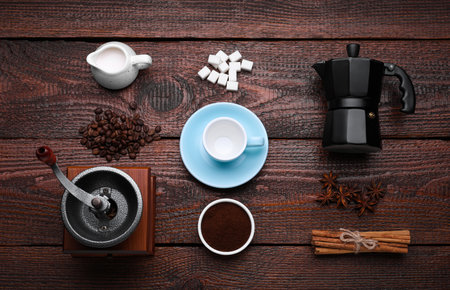 Flat lay composition with vintage manual grinder and geyser coffee maker on wooden backgroundの写真素材