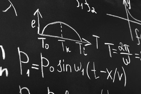 Many different math formulas written on chalkboard, closeupの写真素材