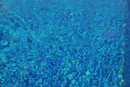 Outdoor swimming pool with clear water on sunny day