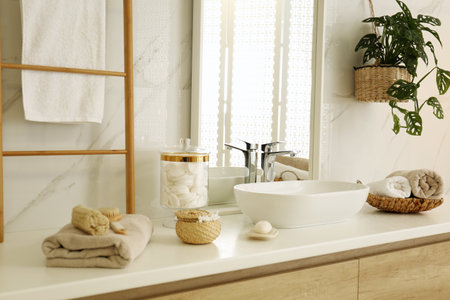 Large mirror and vessel sink in stylish bathroom