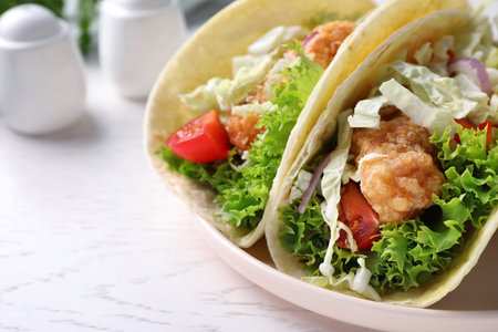 Yummy fish tacos served on white wooden table, closeupの写真素材