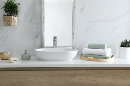 Modern bathroom interior with stylish mirror and vessel sinkの写真素材