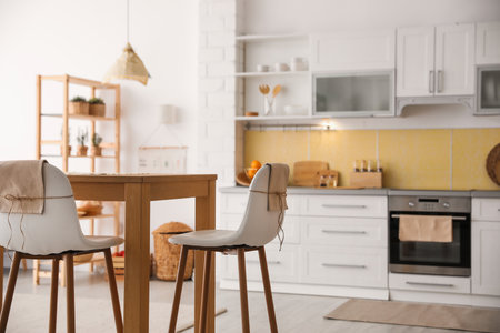 Modern kitchen interior with stylish wooden tableの写真素材