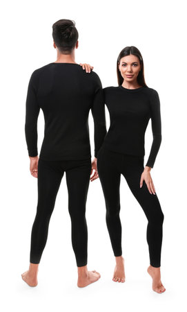 Couple wearing thermal underwear isolated on whiteの写真素材